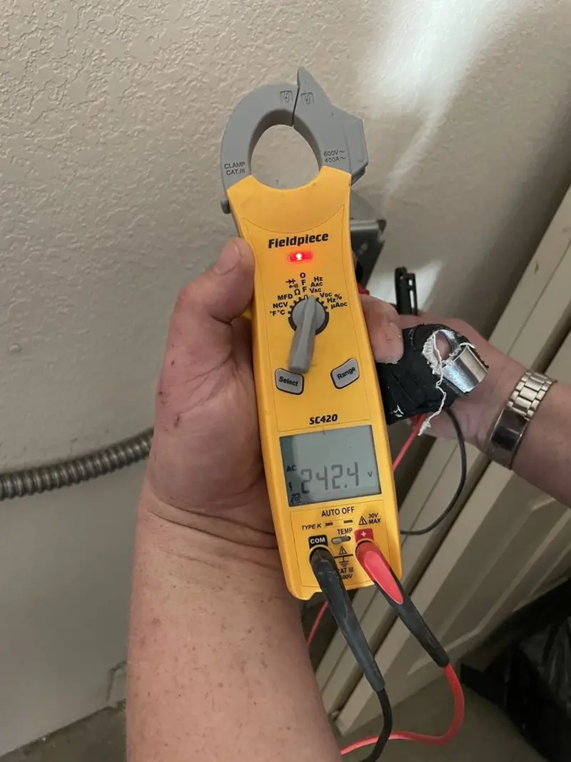 Voltage testing with clamp meter during Aluminum Wiring Replacement in Orono